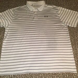 UNDER ARMOUR POLO SHIRT SIZE XXL (SMALL INK STAIN AS SHOWN IN PHOTO)